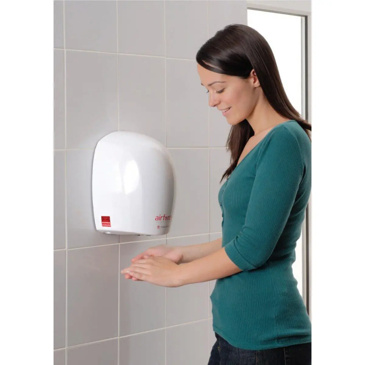 Lady using the economical Airforce hand dryer in white